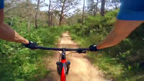 Video of mountain biking on a dirt road, three different views — Stock Video