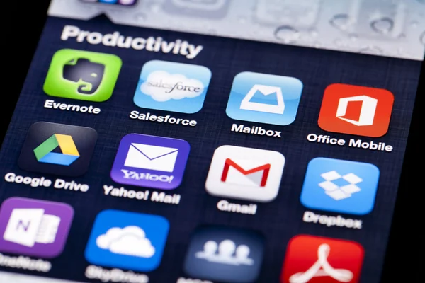 Close-up image of an iPhone screen with icons of productivity apps — Stock Photo, Image