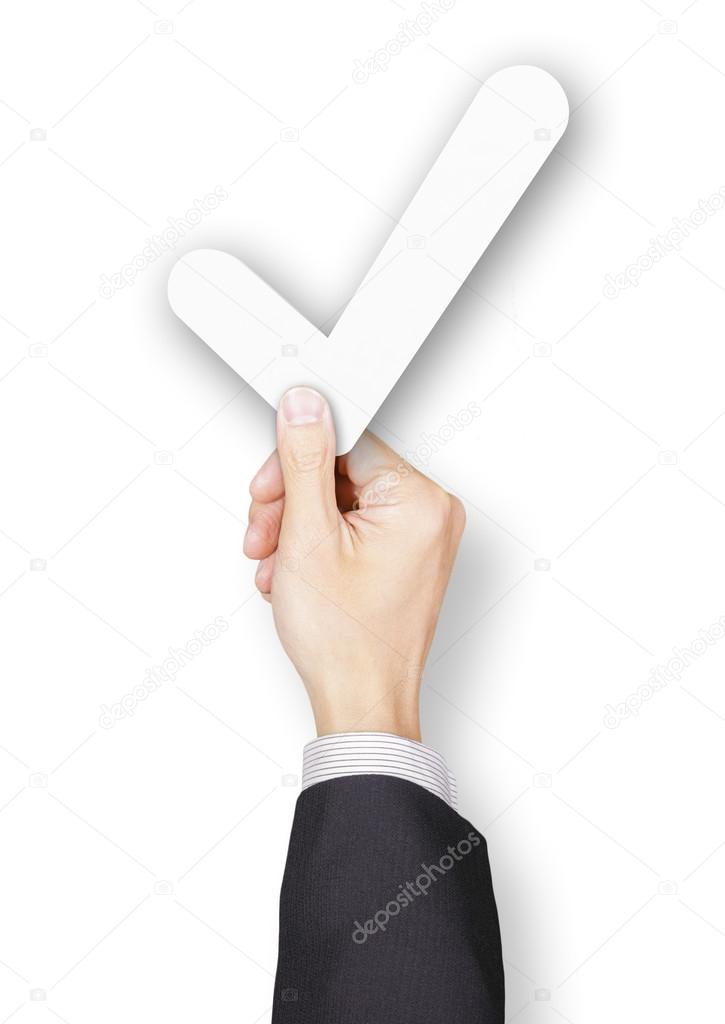 Hand of businessman holding paper tick