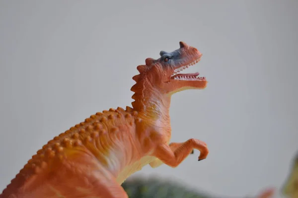 object photo of toy dinosaurs on a white background