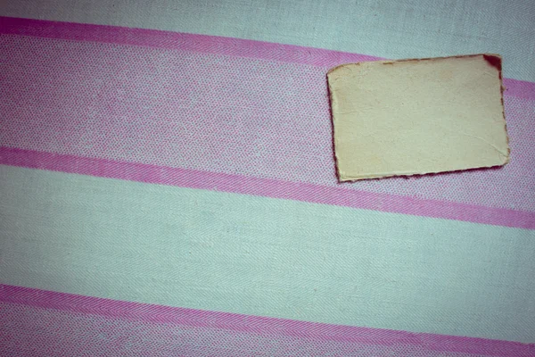 Vintage paper on textile background — Stock Photo, Image