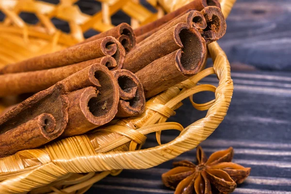 Cinnamon sticks in basket — Stock Photo, Image