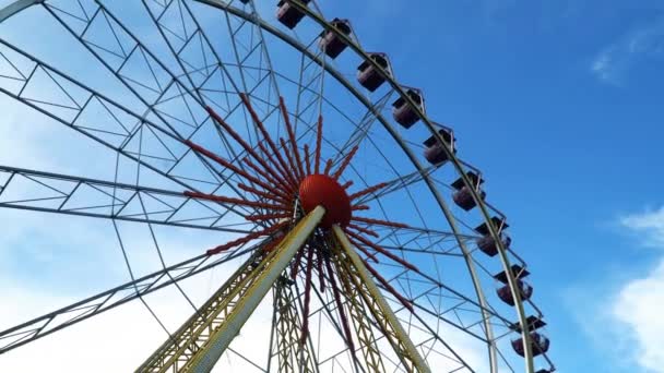Ferris wheel against the sky with clouds — Stock Video