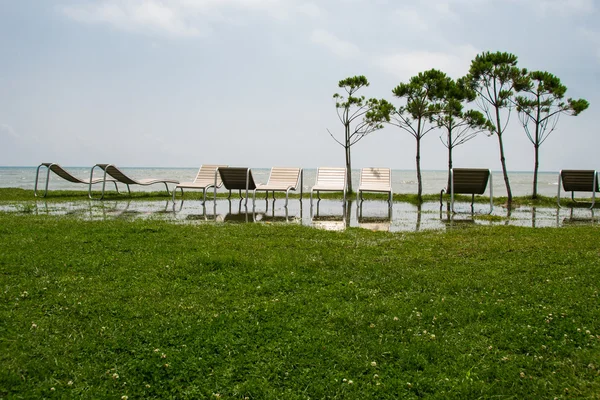 Seaside resort, chaise longue, sea, grass, trees Georgia — Stock Photo, Image