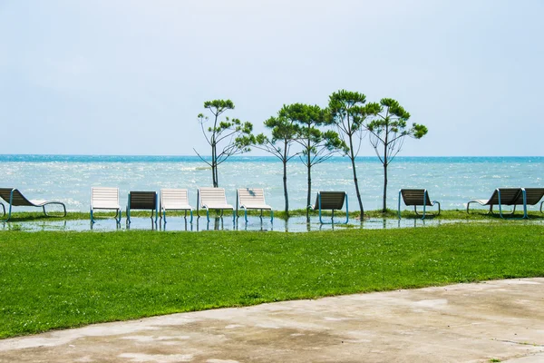 Seaside resort, chaise longue, black sea, grass, trees — Stock Photo, Image