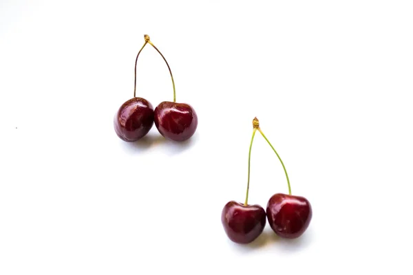 Two couple sweet cherries place diagonally — Stock Photo, Image