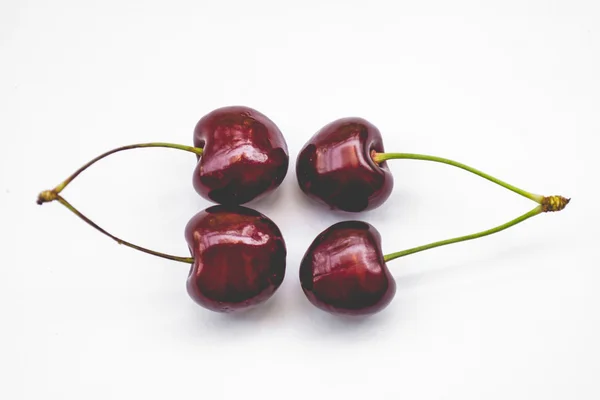 Two couple sweet cherries, isolated, toned — Stock Photo, Image