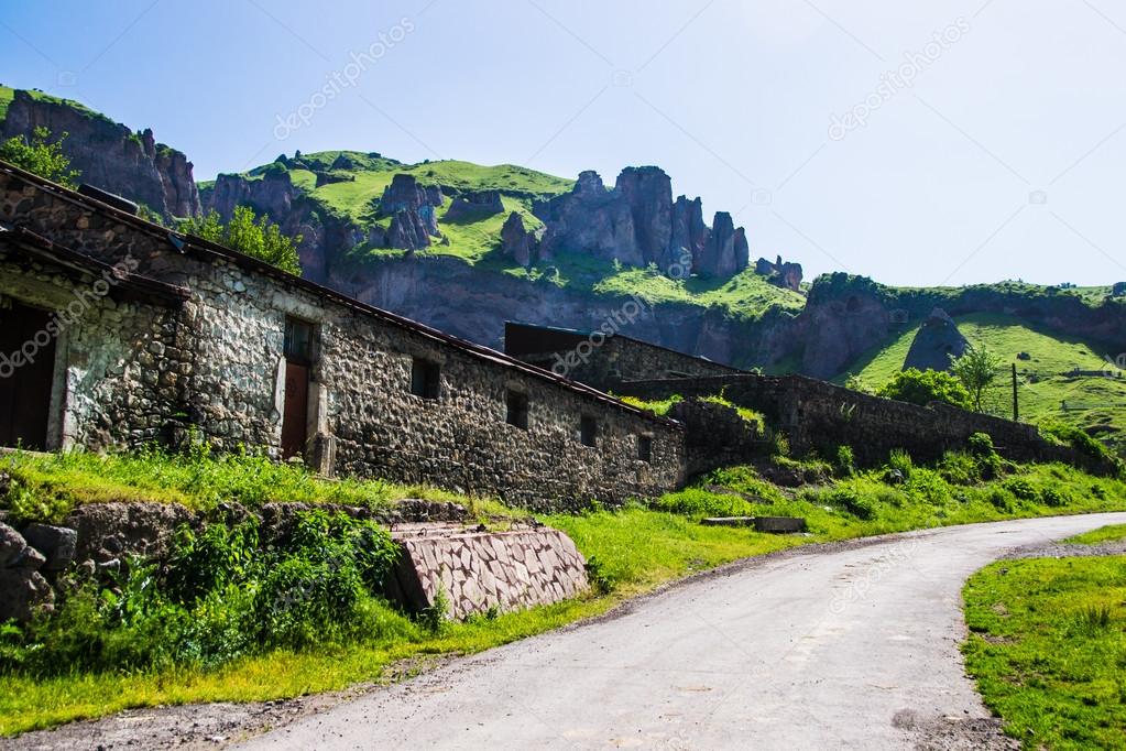 Stone construction, road and rocks on background, Armenia Goris