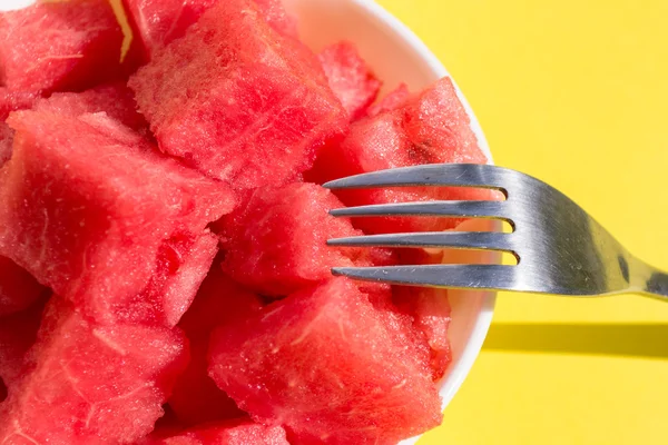 Pieces watermelon in plate with fork, closeup — Stock Photo, Image