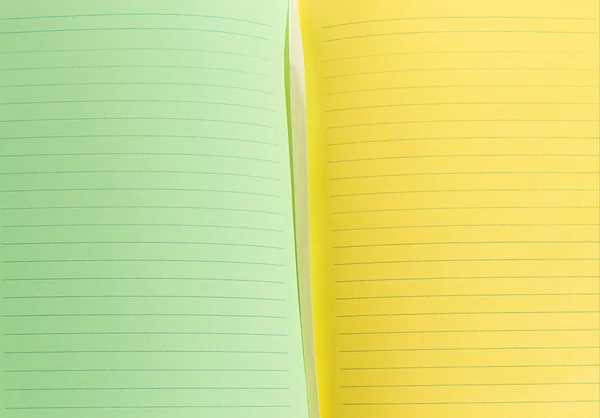 Groene en gele bladen van notebook — Stockfoto