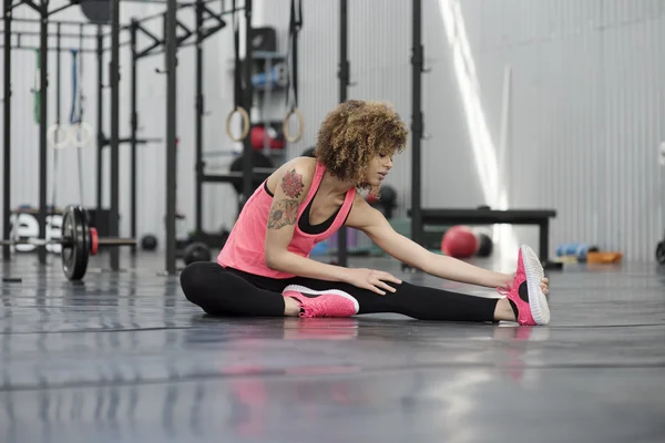 Young girl stretching before workout — Stock Photo, Image