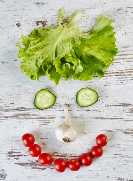 Cara sonriente con verduras — Foto de Stock