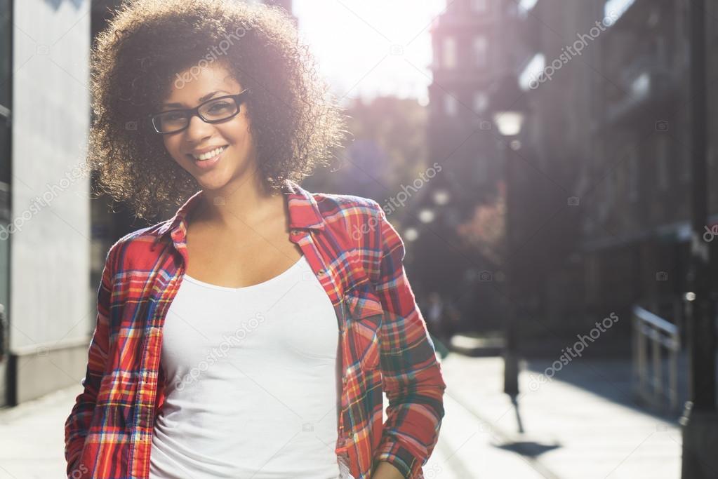 Attractive mixed race girl posing on the street