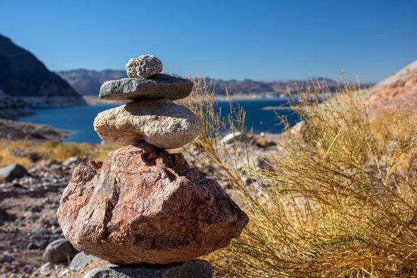 Rock cairn made of stacked rocks marks the location of a campsite near Lake Mead on the Arizona and Nevada border