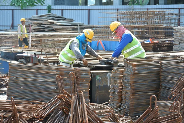 Construction workers working at the bar bending yard