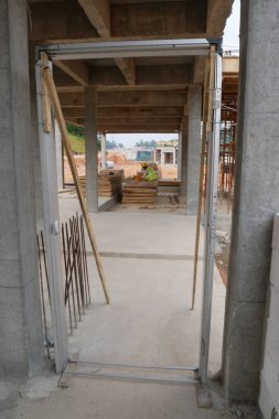 KUALA LUMPUR, MALAYSIA -MARCH 5, 2020: Mild Steel Door Frame at the construction site. Install by construction workers. More quality and durable compare to the wooden door frame. 