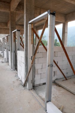 KUALA LUMPUR, MALAYSIA -MARCH 5, 2020: Mild Steel Door Frame at the construction site. Install by construction workers. More quality and durable compare to the wooden door frame. 