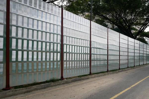 Noise barriers are installed along the vehicle lane bordering the residence to prevent noise pollution to the locals.