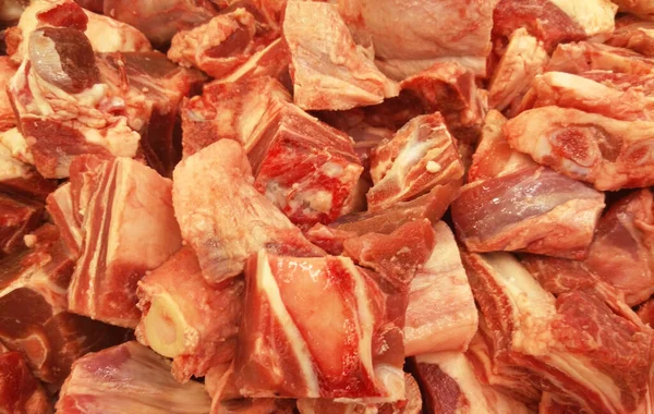 Frozen meat that has been cut into pieces and cubes