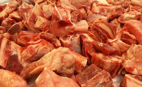 Frozen meat that has been cut into pieces and cubes