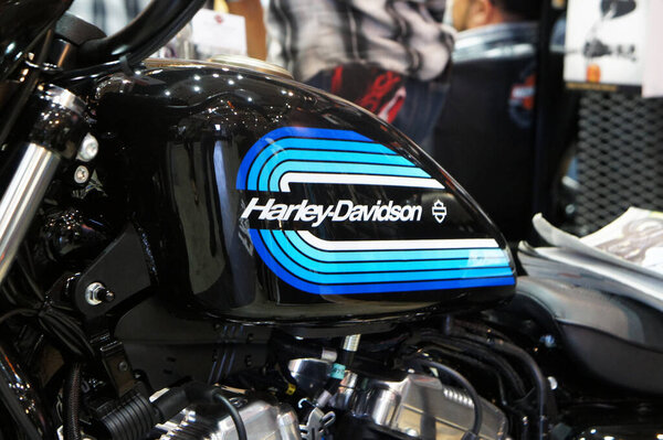 KUALA LUMPUR, MALAYSIA -JULY 30, 2020: Selected focused on Harley-Davidson motorcycle logos design that printed at the motorcycle. Some of the logos were costumes made by the owner.  