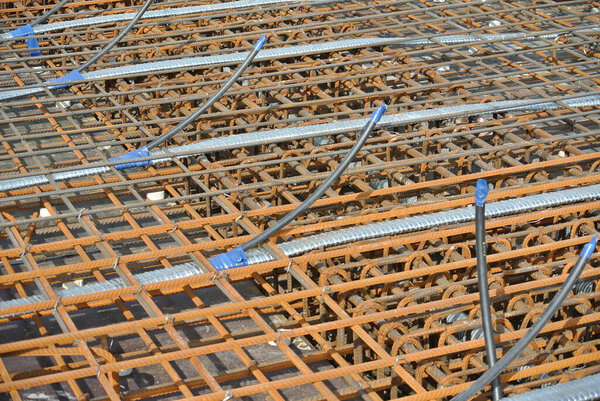 SELANGOR, MALAYSIA -MAY 13, 2016: Steel reinforcement bar at the construction site to form the steel-reinforced concrete slab. It uses to strengthen the concrete. It is shaped to follow the engineer's design.