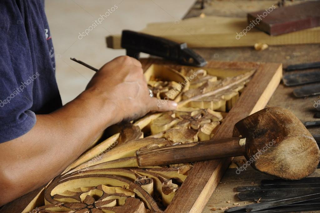Skilled craftsman doing wood carving using traditional method — Stock