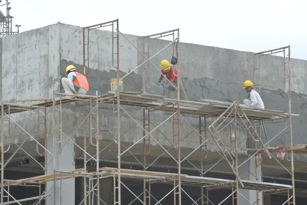 İnşaat işçileri tarafından iş sıvama