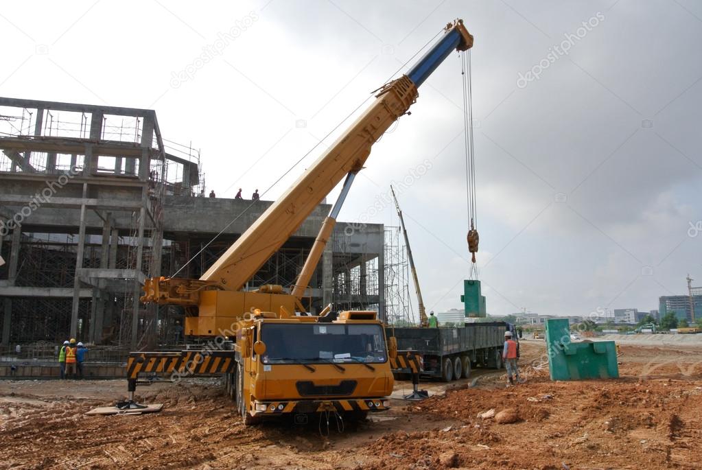 Mobile crane used to lifting heavy material at construction site