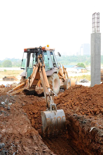 Backhoe machine used for earthwork at the construction site — Stock Photo, Image