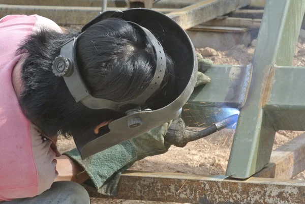 Welder with protective mask welding metal — Stock Photo, Image