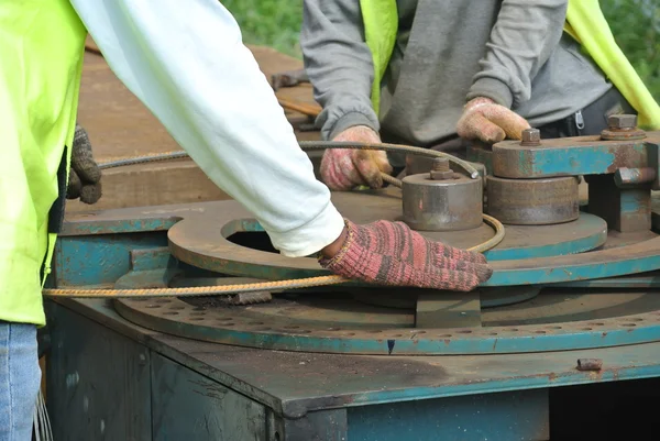 Construction workers bending the reinforcement bar at the bar bending yard