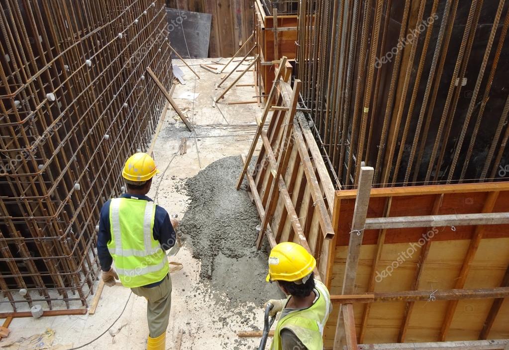 Broken formwork and splash of concrete slurry Stock Editorial Photo