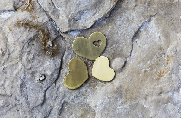 Three Hearts on a Rock with Natural Salt. — Stock Photo, Image