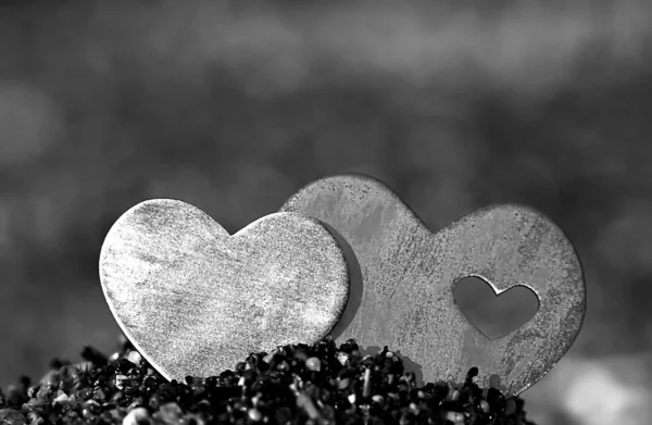 Two Hearts in a Sand Hill on a Rocky Beach — Stock Photo, Image