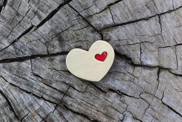 Golden Heart with Small Red Heart on Wood — Stock Photo, Image