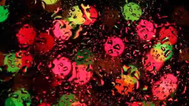 Blurred Christmas Lights Through Raindrops — Stock Video