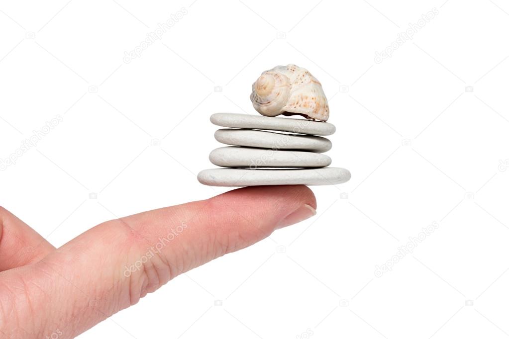 White Stones Balanced On A Finger