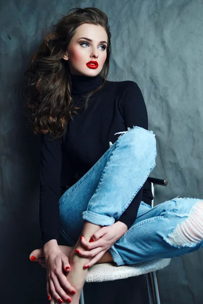 stock image Girl with long curly hair in a black turtleneck.