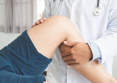Physiotherapist doing healing treatment on patient leg. sport physical therapy concept, panoramic banner