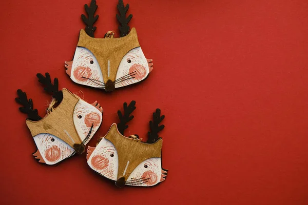 Red Christmas or new year background, simple composition of christmas fox toys, Flatlay, empty space for greeting. — Stock Photo, Image