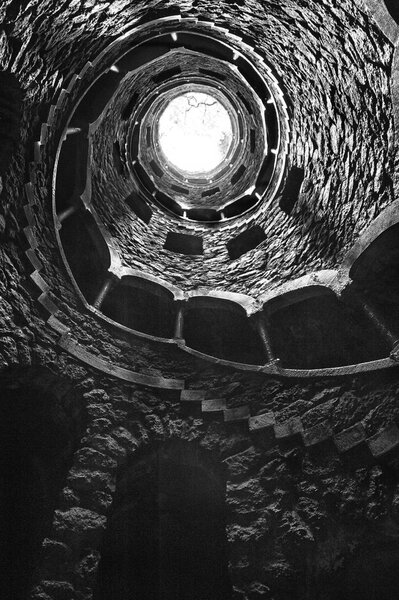 The Initiation well of Quinta da Regaleira in Sintra, Portugal in black and white , downside view