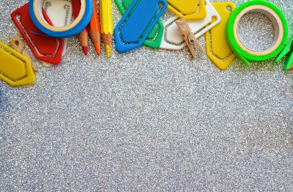 Colored Paints Paper Clips Roll Tape Tweezers Shiny Silver Background — Stock Photo, Image