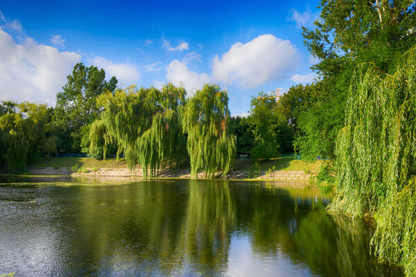 Beautiful lake in the city park in the autumn season