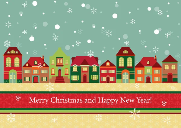 Evler ve kışın kar taneleri.