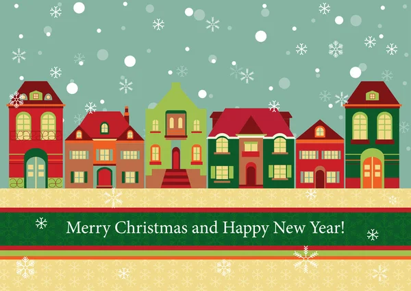 Evler ve kışın kar taneleri.