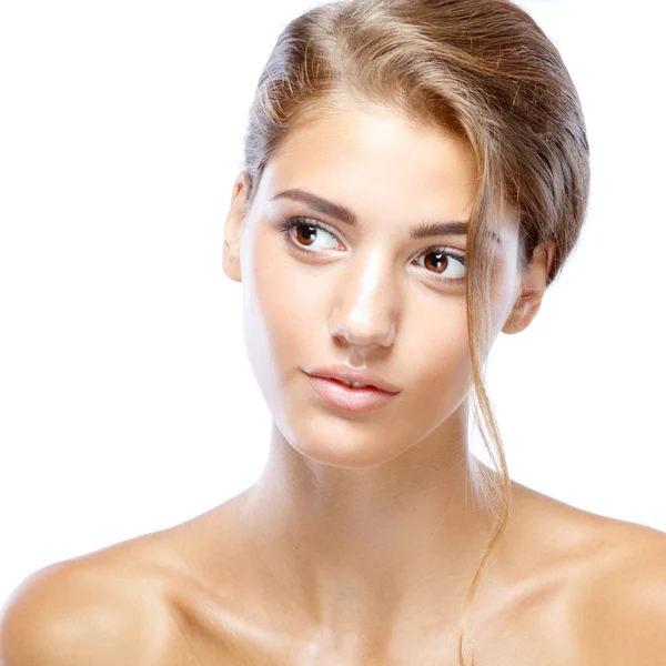 Young woman with clear face natural make up her hair up on a white background — Stock Photo, Image