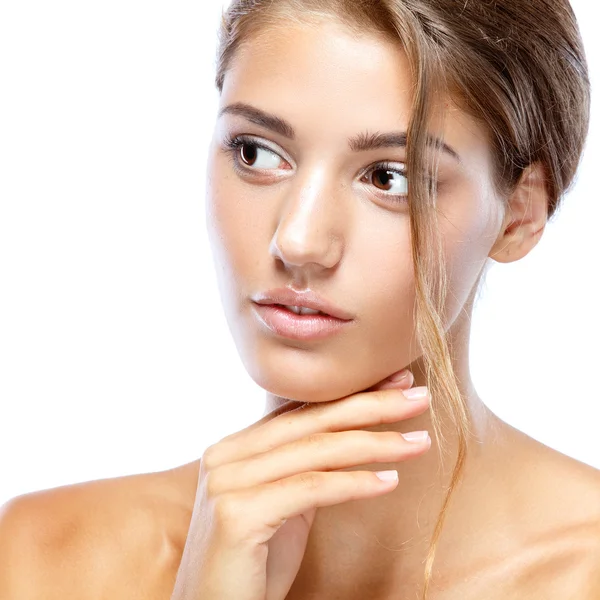 Young woman with clear face natural make up her hair up with a white flower on a light background — Stock Photo, Image