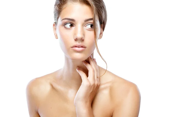 Young woman with clear face natural make up her hair up with a white flower on a light background — Stock Photo, Image