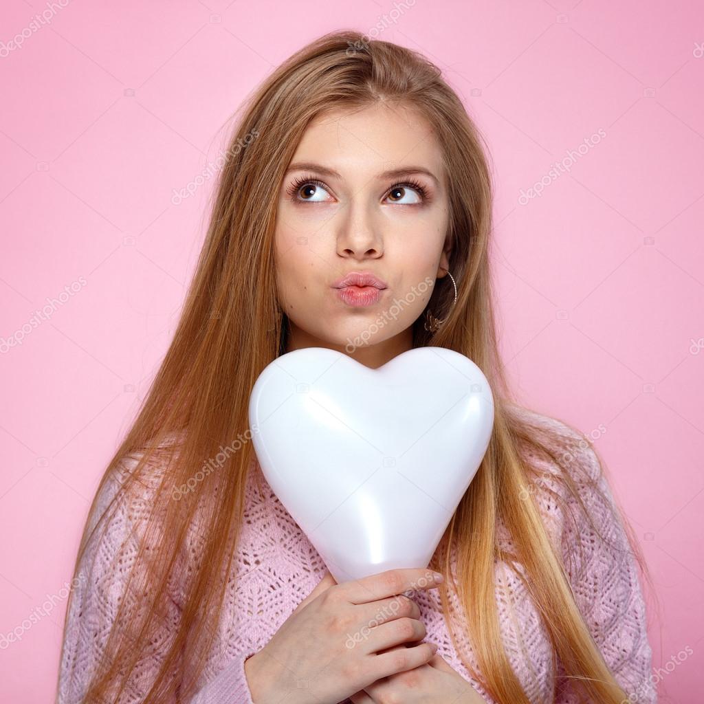 Sweet Blonde Woman Holding A Heartshaped Baloon Studio Portrait Over Pink Background Happy Birthday Sweet Blonde Woman Holding A Heartshaped Baloon Studio Portrait Over Pink Background Happy Birthday